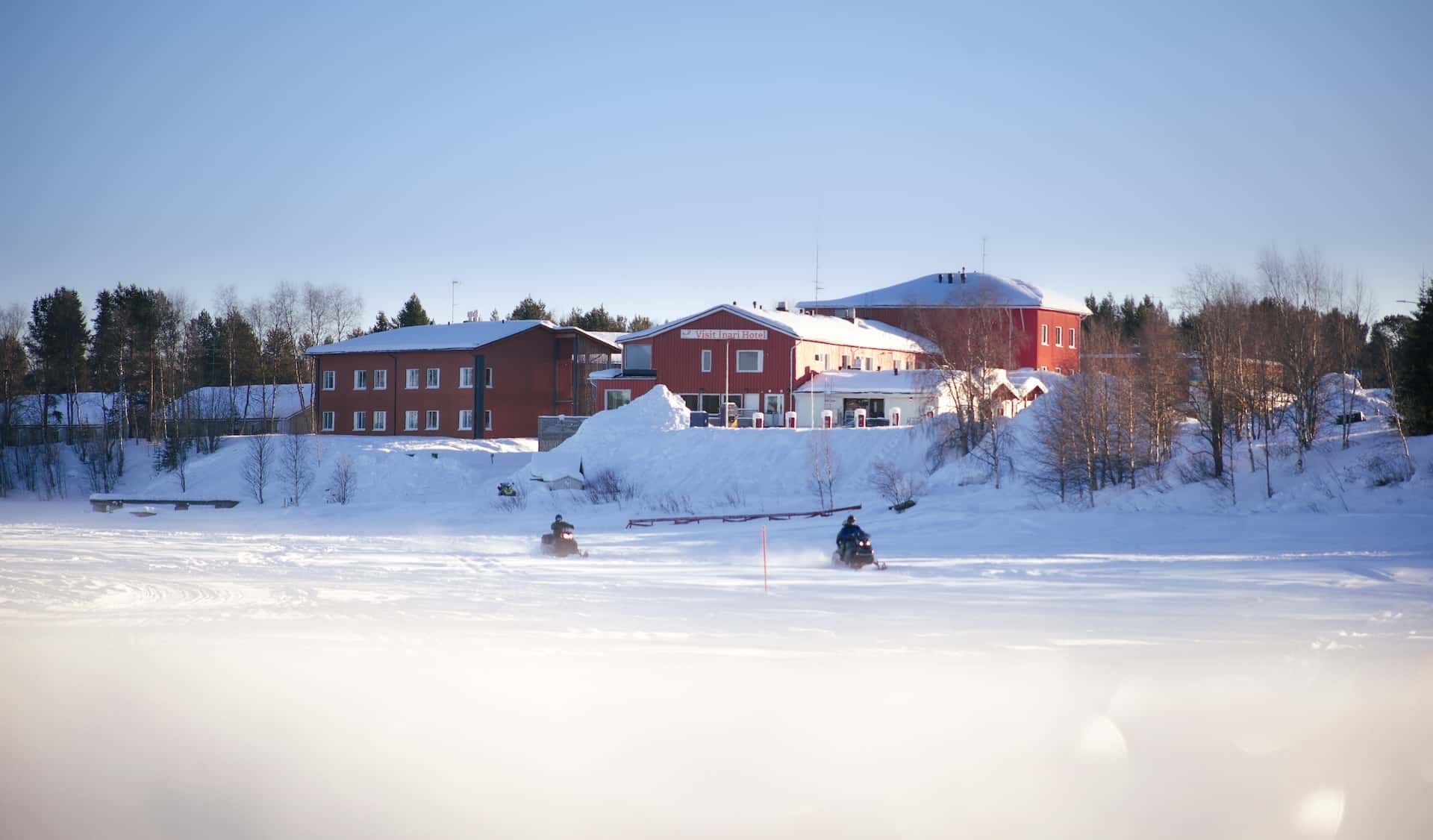 Hotel Inari Winter, Inari Lapland Finland. Two snowmobilers in the front. Pic by Miika Leivo.