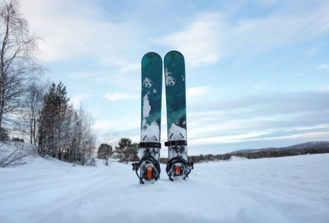 Sliding snowshoes tucked in snow.