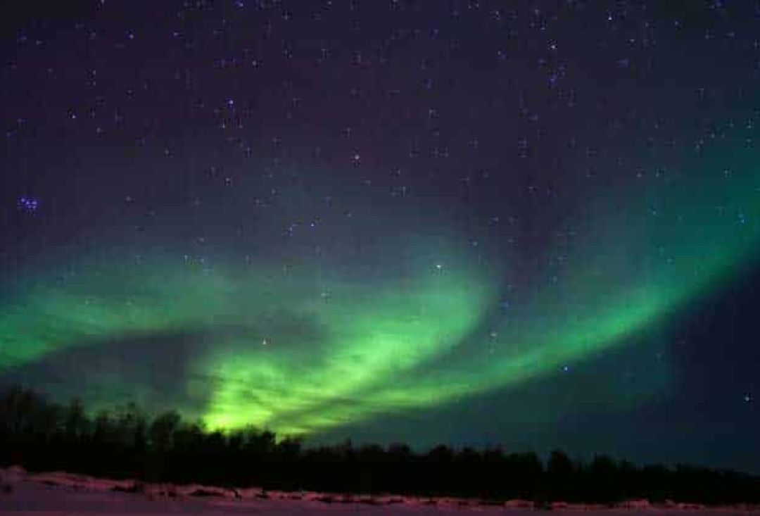 Kind of spiral shaped bright northern lights.