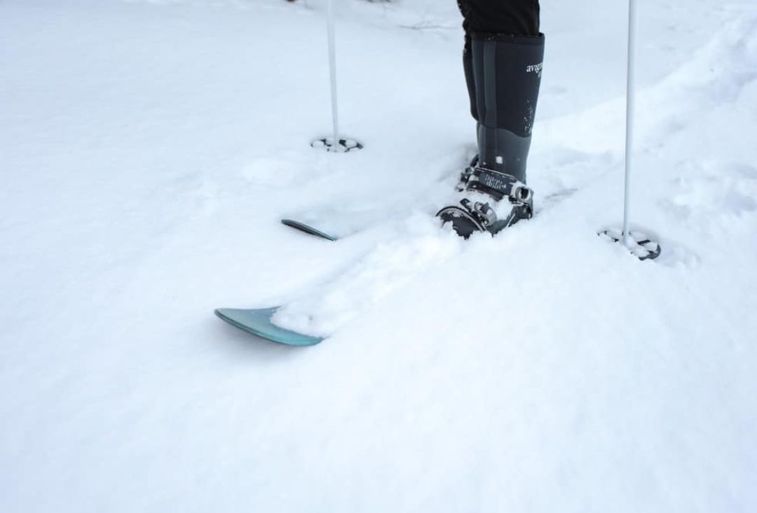 Sliding snowshoes bit under snow while skiing.